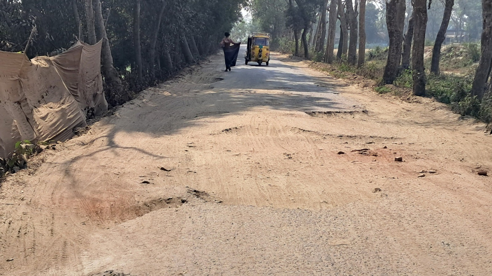 বালুবাহী ট্রাকে ক্ষতিগ্রস্ত হচ্ছে গুরুত্বপূর্ণ আঞ্চলিক সড়ক